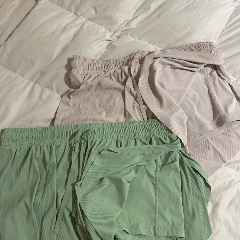 Joy Lab athletic shorts in Olive and Cream.